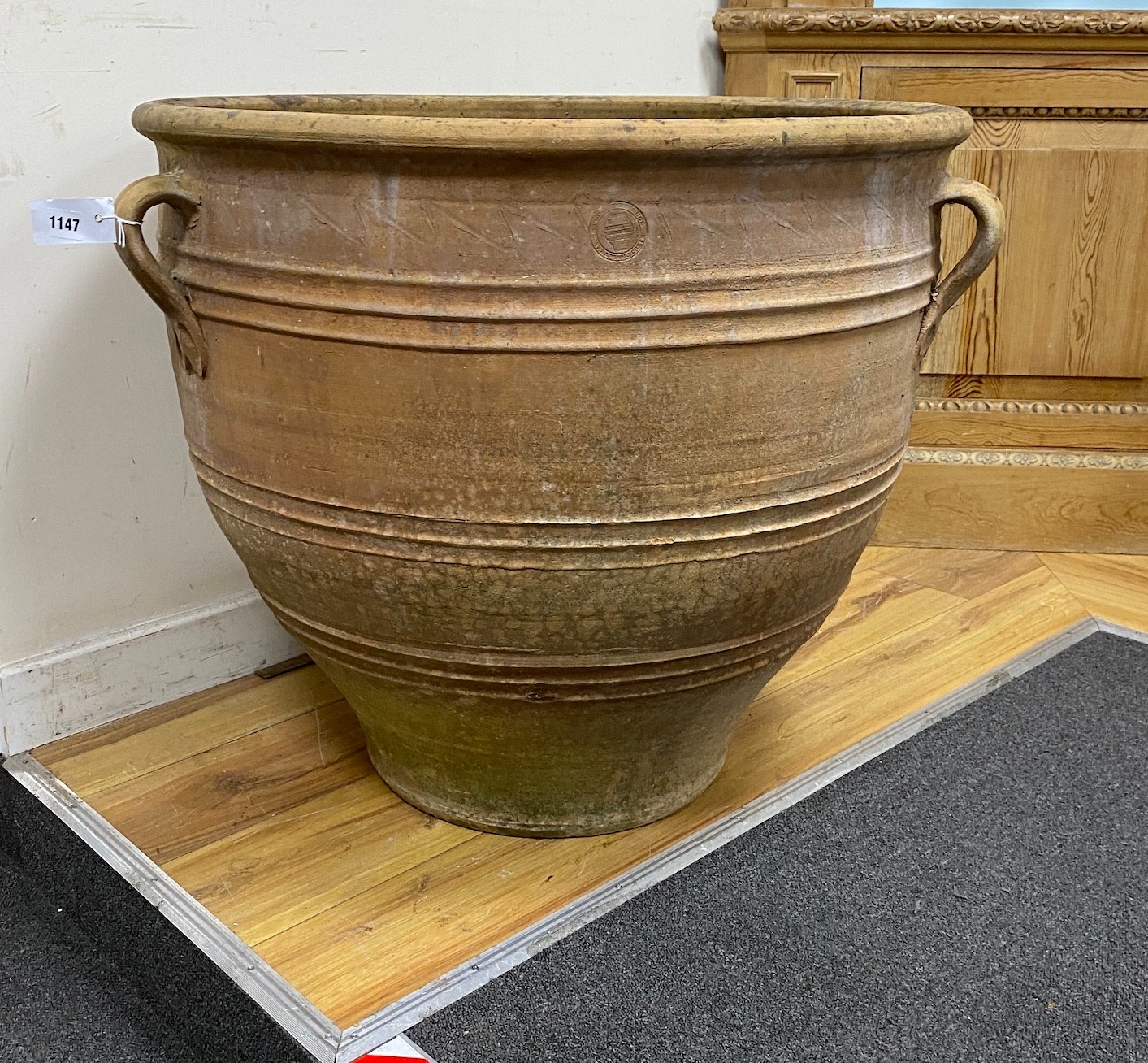 A large circular Grecian style earthenware garden urn, diameter 75cm, height 66cm